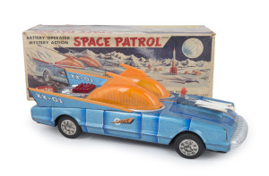 "Space Patrol XX-10" model No.1-174 by Aoshin marked "MADE IN JAPAN" under the chassis, battery operated, features a shooting rocket, jet engine noise and a flashing light, unusually with intact antennas extending from central orange dome; comes with fully illustrated original box showing evocative image of the Space Patrol at the base of a lunar mountain. circa 1950. Length (of car) 32cm (12.5"); Box 35.5cm (14")