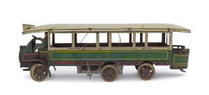 "Autobus Mecanique a 6 Roues" tin-plate omnibus operating the Madelaine to Bastille route, made by J.de P (Jouets de Paris), complete with winding key and bus driver & original box showing the operating instructions on the inside lid. circa 1920s. Length 
