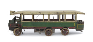 "Autobus Mecanique a 6 Roues" tin-plate omnibus operating the Madelaine to Bastille route, made by J.de P (Jouets de Paris), complete with winding key and bus driver & original box showing the operating instructions on the inside lid. circa 1920s. Length (of bus) 26cm (10.3"); Box 27cm (10.5").