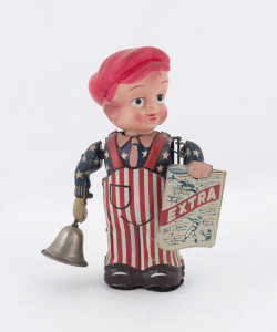 Vintage wind-up Newsboy with bell and "EXTRA" sign; lithographed tinplate with celluloid head and integrated winding key. Marked "MADE IN OCCUPIED JAPAN", dressed in American colours and with baseball and horse racing featuring on the banner. Height: 15cm (6").