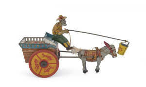 1920's FERDINAND STRAUSS (U.S.A.) "JENNY THE BALKING MULE" tinplate lithographed wind-up toy depicting the stressed farmer, riding atop of cart full of fruits while trying to urge his mule forward by dangling a pail of oats in front of him. Trademark printed at rear of cart. Length: 25cm (10").