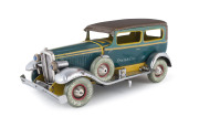 A FRANKLIN TWO DOOR SEDAN by NOMURA, JAPAN.&nbsp;A very scarce pre-war lithographed tin automobile with electric head lights, done in blue body, yellow trim, brown roof, features spare wheel on running board, red light at rear, clockwork driven, reads, "Frankl