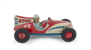 "Atom 45" friction tinplate racing car with driver by Marusan, red, cream & pale blue livery, windshield, axles and four rubber tyres intact., marked "MARUSAN/SAN(in circle)/MADE IN JAPAN". Circa 1950s. Length 21.5cm (8.5").