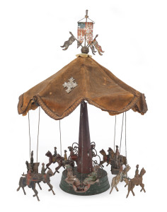 Merry-Go-Round or Carousel, German, attributed to Gunthermann, hand painted tin, ornate tower support with canopy top, four gondolas with seated figures and carousel horses with riders, clockwork driven. Height: 41cm (16"). A restoration project.