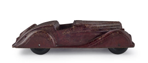 Art deco style bakelite two-seater sports car made by Codeg (England), in mottled brown with black bakelite wheels; circa 1930s; length 34cm (13.5").