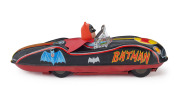 MASUDAYA / MODERN TOYS BATMOBILE. This circa 1960s Batmobile is tinplate litho, with rubber, friction driven wheels and a vinyl Batman driving with his vinyl cape flapping in the wind behind him. Length: 32cm (12.5"). - 2