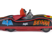 MASUDAYA / MODERN TOYS BATMOBILE. This circa 1960s Batmobile is tinplate litho, with rubber, friction driven wheels and a vinyl Batman driving with his vinyl cape flapping in the wind behind him. Length: 32cm (12.5"). - 5