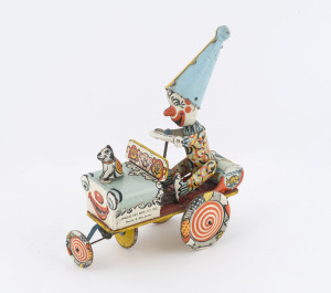 Artie the Clown Car wind-up lithographed tinplate toy made by Unique Art Mfg Co (Newark, NJ, USA), attractively coloured, appears intact; length 19cm (7.5").