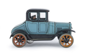 1920s Bing German tinplate Coupe with uniformed driver; integrated clockwork mechanism; pale blue chassis and black detailing; metal spoked wheels. Length: 16.5cm (6.5").