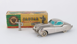 "Jaguar XK120 Sport-Coupe" wind-up metal toy car with key styled in form of traffic policeman, by Prameta Kolner, chrome finish & tinted windows with steering and gear shift levers on chassis which is marked "MADE IN/GERMANY/Brit.Zone", comes with original box and instructions, length (of car) 15cm (6"), box 16cm (6.3")