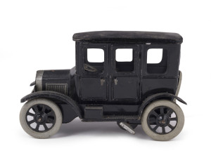 Tinplate windup four-door limousine, probably by OROBR, Germany; with two doors that open, spare wheel at rear. Length: 15.5cm (6.25").