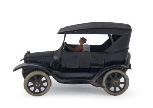 Tinplate wind-up Ford Model-T sedan with driver by BING, Germany 1920s; spare wheel at rear, number plates (19872) front and rear. Length: 16cm (6.25").