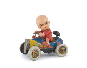 CELLULOID BOY RIDING CAR Pre-war Japan, by Modern Toys, lithographed tinplate, colourful open racer with bell on boat tail fin, key wind operated, full celluloid figure holds steering wheel. Length: 16cm (6.25") Provenance: Bertoia Auctions - Lot 714 Nov.11, 2011.
