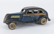 KOSUGE (?) wind-up tinplate 4-door sedan in dark blue, marked "MADE IN JAPAN" at bottom of driver's door, c.1930s, length 18cm (7"). - 2