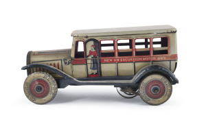 "New An Excursion Motor Bus" wind-up made by Nomura (Japan, 'T.N.' trademark at the back), lithographed tinplate with passengers stood in both doorways and "DUNLOP TYRES" on each wheel, circa 1930s. Length 18cm (7").