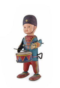Drummer boy wind-up with tinplate body and celluloid head wearing a shako, marked "MADE IN JAPAN" with "Rising Sun" trademark on the back of the drummer and on the drum. circa 1930s. Height 15cm (6")