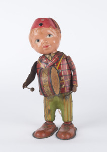 Celluloid head drummer boy with lithographed tinplate body, clockwork mechanism and vertically mounted drum. By Wakimura, Japan, circa 1950.