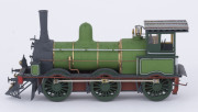 c.1875 Q Class (Q83) Steam Locomotive (195x35x50mm), green livery with gold trim, 0-6-0 wheel configuration, with rolling stock comprising two 'D' class Guard Vans and four freight wagons containing aggregate, total size 700x35x50mm. (8 items) - 3