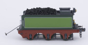 c.1875 Q Class (Q83) Steam Locomotive (195x35x50mm), green livery with gold trim, 0-6-0 wheel configuration, with rolling stock comprising two 'D' class Guard Vans and four freight wagons containing aggregate, total size 700x35x50mm. (8 items) - 4