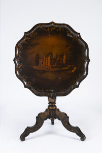 A hand-painted Chinoiserie tilt top occasional table with ebonised finish, early 19th century, 74cm high, 74cm across