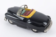 1950s convertible black Cadillac in original box "ELECTRIC OPEN CAR" by KKK, Japan; tinplate, battery driven, rubber tyres, steering wheel and on/off switch on dashboard. Length: 18cm (7"). - 2