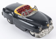 1950s convertible black Cadillac in original box "ELECTRIC OPEN CAR" by KKK, Japan; tinplate, battery driven, rubber tyres, steering wheel and on/off switch on dashboard. Length: 18cm (7"). - 4