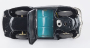 1950s convertible black Cadillac in original box "ELECTRIC OPEN CAR" by KKK, Japan; tinplate, battery driven, rubber tyres, steering wheel and on/off switch on dashboard. Length: 18cm (7"). - 6
