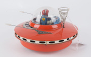 YOSHIYA SKY PATROL FLYING SAUCER circa 1965When it hits an object, the beautifully lithographed female astronaut/pilot moves the levers and steers her flying saucer in a new direction. "K.O." in a diamond trademark on the back of the seat. Battery operate - 3