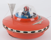 YOSHIYA SKY PATROL FLYING SAUCER circa 1965When it hits an object, the beautifully lithographed female astronaut/pilot moves the levers and steers her flying saucer in a new direction. "K.O." in a diamond trademark on the back of the seat. Battery operate - 5