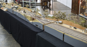 Electric powered diorama depicting a South Australian scene created in three conjoining sections, featuring mainline station (similar in design to those at Strathalbyn & Mount Barker), branchline stations, workshop, bridges, viaduct, turntable, coal bunker, sidings, signalling plus scenic features including station furniture, trees, foliage, figures and horse & carts, plus track with broad gauge, narrow gauge & mixed gauge sections along with the power supply unit, adaptors & transformer