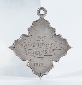 CAMBRIDGE CRICKET CLUB: A sterling silver medal engraved on the front "A Special Prize Presented to C. McDonell" and on reverse "By Cambridge C.C. Season [18]86-87."