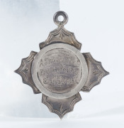 CAMBRIDGE CRICKET CLUB: A sterling silver medal engraved on the front "A Special Prize Presented to C. McDonell" and on reverse "By Cambridge C.C. Season [18]86-87." - 2