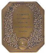 1938 THIRD BRITISH EMPIRE GAMES, SYDNEY, AUSTRALIA: Participation Medal, octagonal in bronze, 63 x 75mm, engraved by D.E. Morden; by Stokes of Melbourne; reverse engraved for "A. H. GARNSEY CITY ENGINEER Member of Housing and Transport Committee."   - 2