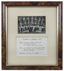 THE AUSTRALIAN TEAM IN ENGLAND - 1921 An original real photo postcard of the Australian Touring Party, signed in pen by all 16 players and officials, attractively mounted together with details of the team. Signatories include Armstrong (Captain), Bardsley