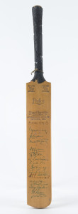AUSTRALIA v ENGLAND, 1958 - 59 A miniature Stuart Surridge bat signed on the front of the blade by the English Touring party including May, Laker, Bailey, Dexter, Trueman, Statham and Tyson. Also signed by F.R.Brown, Jack Ryder, Bert Oldfield, Gil Langley and others. Australia won the 5 Test Seres, 4-0.