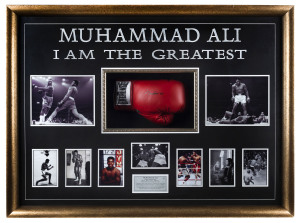 "MUHAMMAD ALI : I AM THE GREATEST" large framed display featuring a signed Everlast brand boxing glove surrounded by nine iconic images from Ali's career together with a plaque providing his fight chronology. With a CofA on reverse together with a photograph of Ali signing one of the 225 gloves he signed on 12th & 13th June, 1998 in New York City. Glazed, overall 85 x 115cm.
