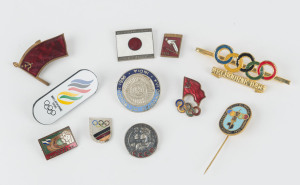 BADGES & PINS: A group including Japanese Delegation 1956, India 1956 Team badge, Russia, Germany, etc. (11).