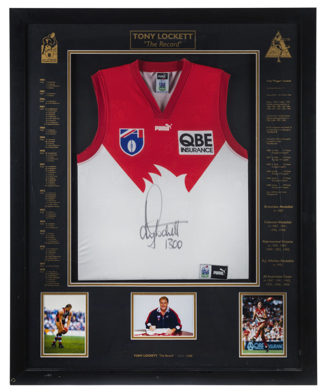 TONY LOCKETT (Sydney Swans): AFL limited edition framed & glazed display, commemorating Lockett breaking the all-time AFL kicking record when booting his 1300th career goal, with signed guernsey and three inset photographs of Lockett, CofA numbered 1092/1