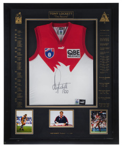 TONY LOCKETT (Sydney Swans): AFL limited edition framed & glazed display, commemorating Lockett breaking the all-time AFL kicking record when booting his 1300th career goal, with signed guernsey and three inset photographs of Lockett, CofA numbered 1092/1