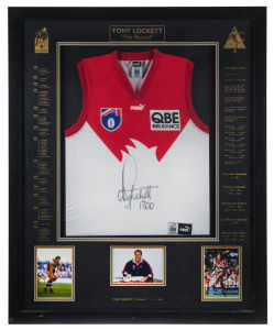 TONY LOCKETT (Sydney Swans): AFL limited edition framed & glazed display, commemorating Lockett breaking the all-time AFL kicking record when booting his 1300th career goal, with signed guernsey and three inset photographs of Lockett, CofA numbered 1092/1300, overall 88x110cm.