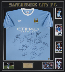 MANCHESTER CITY: mounted display with team jersey signed by members of 2013/14 Premiership & League Cup winning squad, surrounded by action photographs