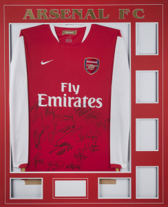 ARSENAL: 2006/07 long sleeve 'home' team jersey mounted on plain unfinished display, signed by squad members including Thierry Henry, Robin van Persie, Theo Walcott, Cesc Fabregas, Kolo Toure & William Gallas. On the inside neck is a gold label inscribed "The new home of Arsenal/Emirates Stadium", 2006/07 being the first season that home games were played at the club's new home, overall 81x101cm.