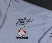 MARK SKAIFE: c.2008 Hugo Boss short-sleeved shirt for Holden Racing Team on a wooden framed mounted display with two inset action images beneath plus a commemorative plaque celebrating Skaife's race wins for the Holden Racing Team, the shirt signed by Mar - 2