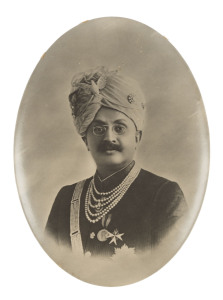 RANJITSINHJI OF NAWANAGAR OVAL METAL TABLE PLAQUE: c.1907 created for his coronation, showing an oval bust portrait of Ranji (9x12.5cm). Very Fine.