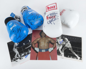 BOXING COLLECTIBLES GROUP: comprising pair of Fenech 10oz signed boxing gloves noting Barry Michael, Azumah Nelson, Jeff Fenech, Kos Tszyu & Tony Mundine; another pair with unknown signature; also signed coloured photograph of George Foreman, plus Johnny Famechon signed Associated Press black & white action photos of his fights with Jose Legra and his 1970 successful World Title contest and rematch against Fighting Harada. (5 items)