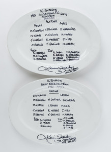ESSENDON: two plain oval dinner plates, both written on and signed by Sheedy, the first plate showing "K.Sheedy's Best Essendon Team 1981-2007", the second plate showing "K.Sheedy's Essendon F.C. Assistant Coaches 1981-2007"; the plates created as a fund raiser for the Flagstaff Hill FC in South Australia. Unique.