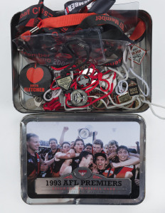ESSENDON: array of 2001-2014 membership badges various designs/shapes including silver memberships, also a small quantity of Essendon lanyards; all housed in a 1993 Essendon AFL Premiers Butter Cookies biscuit tin. (35, plus lanyards & tin)