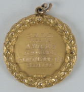 15ct gold football medallion (by Willis, Melbourne) with a running player on the front and engraved on reverse "C.D.F.C. Pres. to A.WILSON by WAL OWEN for CONSPICUOUS PLAY, Seas. 1920" - 2