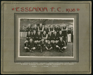 ESSENDON FOOTBALL CLUB: 1938 official team photograph in front of the stand at Windy Hill. Names of players annotated on the mount below including that year's Brownlow medallist, Dick Reynolds. Overall 20 x 25cm.