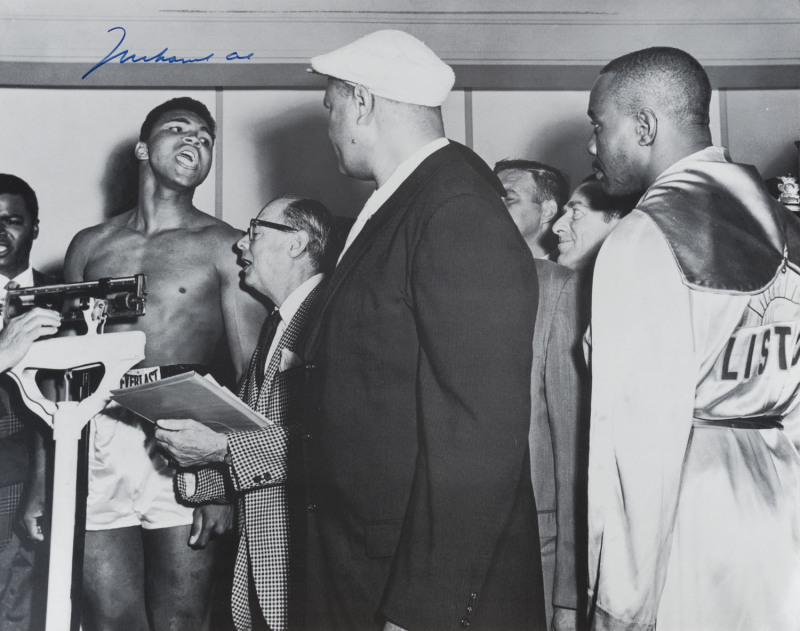 MUHAMMAD ALI, signed b/w photograph of Ali at the weigh-in with Sonny Liston, size 40.5 x 50.5cm.